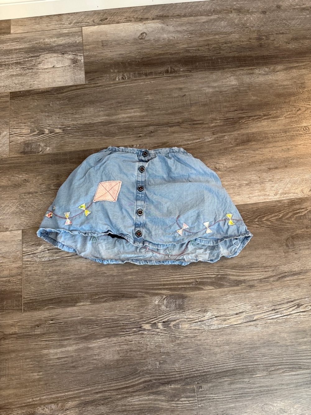 Light Blue Denim Girls' Skirt with Button Front and Embroidered Bows